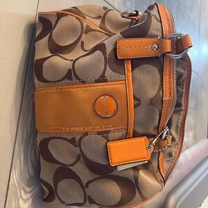 Gently used coach bag , has some wear and tear